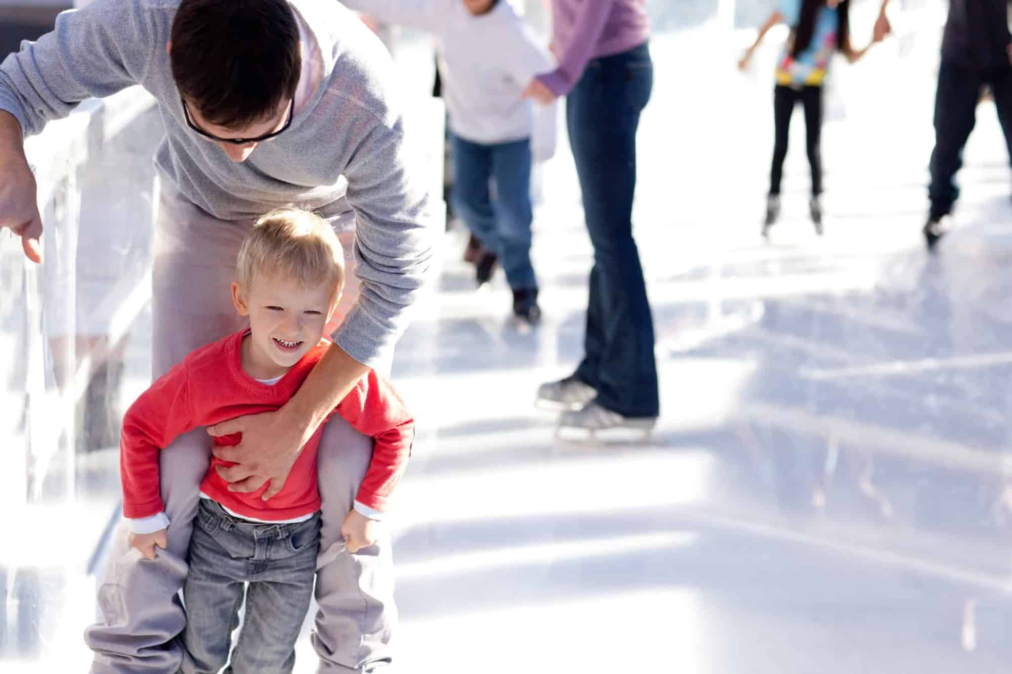 Child ice skating at Christmas