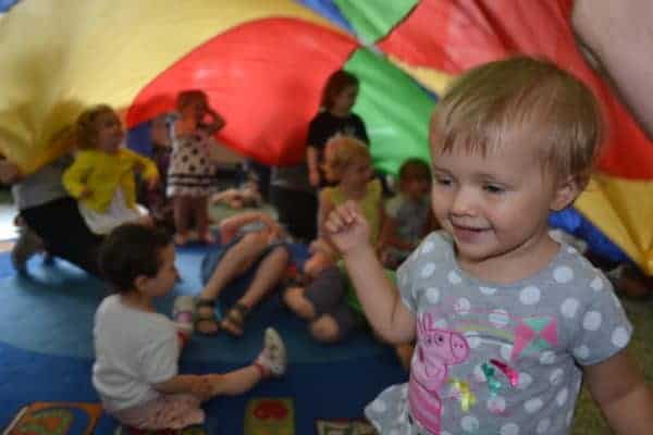 Toddler group under the parachute