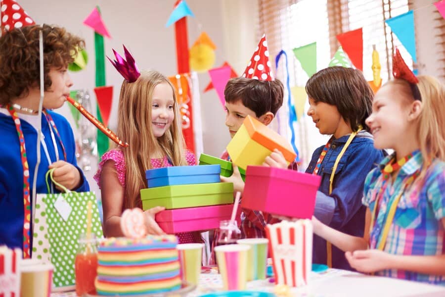 Children joyfully celebrating at a vibrant party with disco lights, fun games, and Disco and Games Parties.