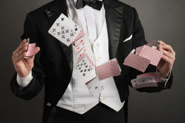 depositphotos_5645591-stock-photo-magician-juggle-card